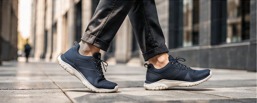 Navy everyday walking shoes on a city sidewalk